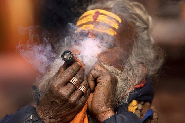 Tens of thousands gather for Hindu festival at Nepal temple, with many lighting up marijuana joints